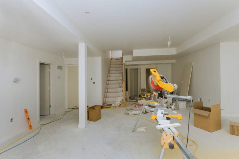 Bright, well-maintained home interior with neutral walls, updated lighting, clean floors, and simple furnishings.